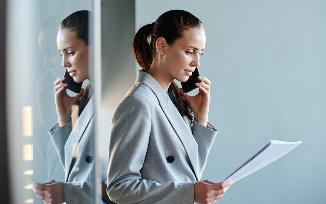 financial director in grey suit looking at documents